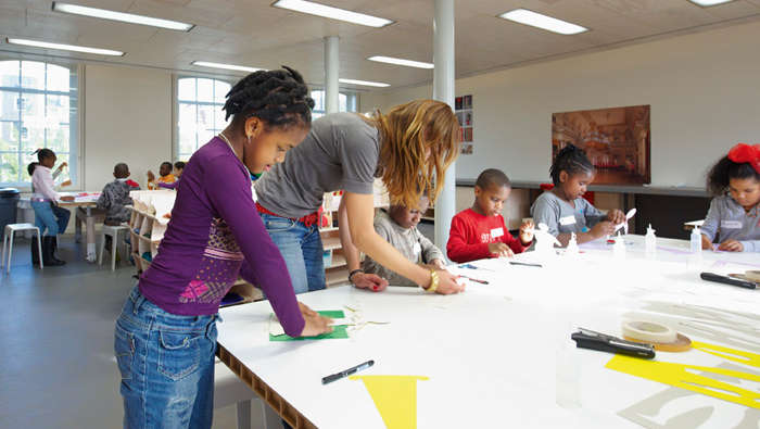Students are having workshops in a class at Hermitage, Amsterdam illuminated with Philips energy-efficient lighting 