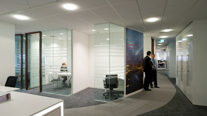 The corridor of Manchester Airport Olympic House illuminated by Philips led office lighting.