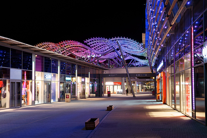 The outstanding entrance of Carré de Soie Shopping Mall illuminated by Philips Lighting and Axente