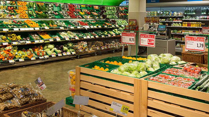 A well-stocked fresh fruit and vegetables section of a German supermarket. - reduce energy cost